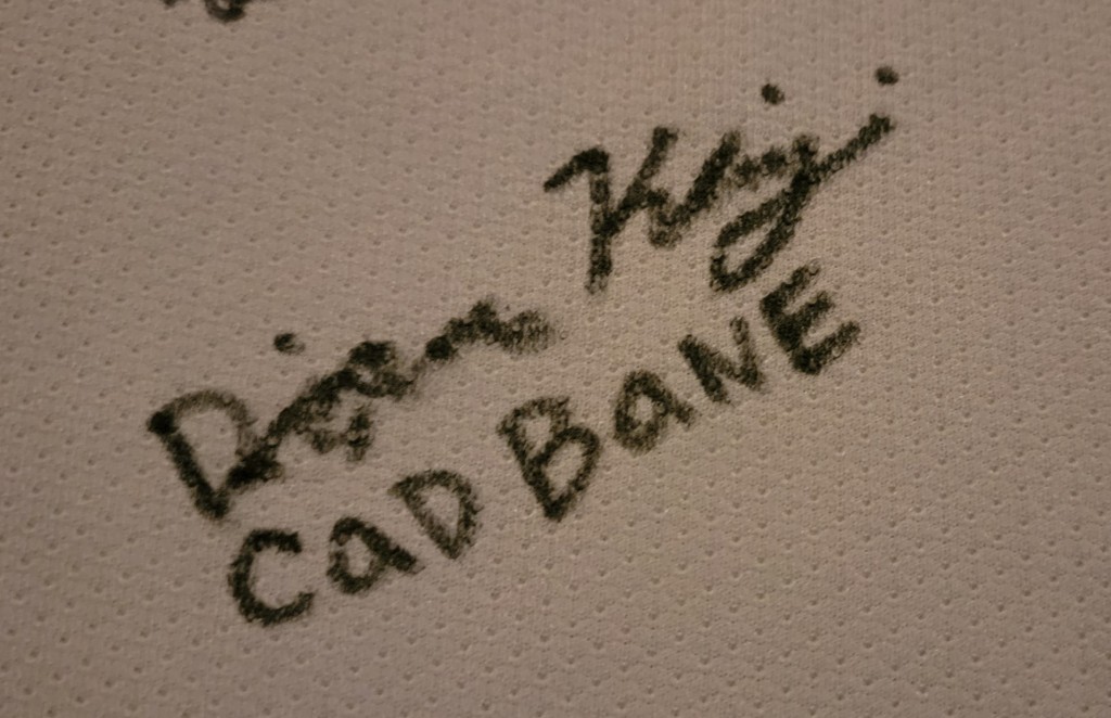 Signature of Dorian Kingi with Cad Bane  written underneath